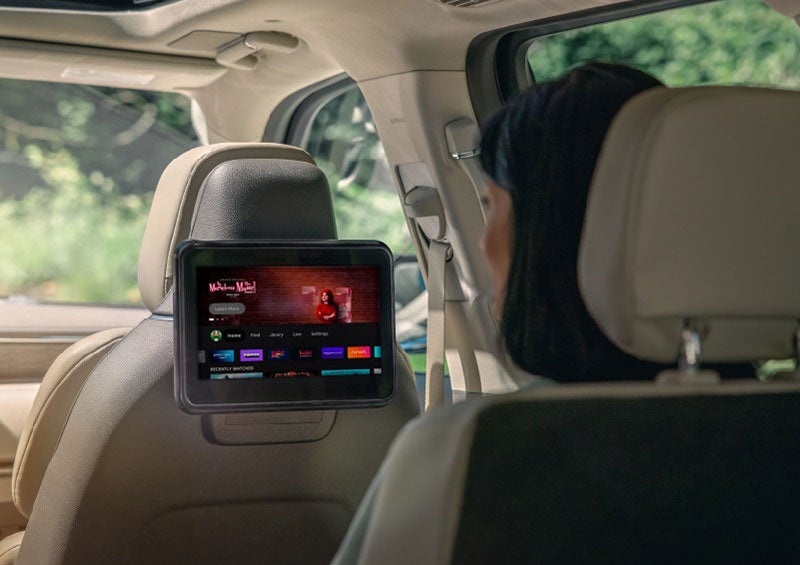 A person is seated in a 2023 Lincoln Nautilus SUV viewing an available entertainment screen. | Gary Yeomans Lincoln Ocala in Ocala FL
