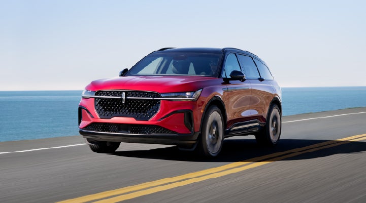 A 2025 Lincoln Nautilus® SUV is being driven on a seaside roadway. | Gary Yeomans Lincoln Ocala in Ocala FL