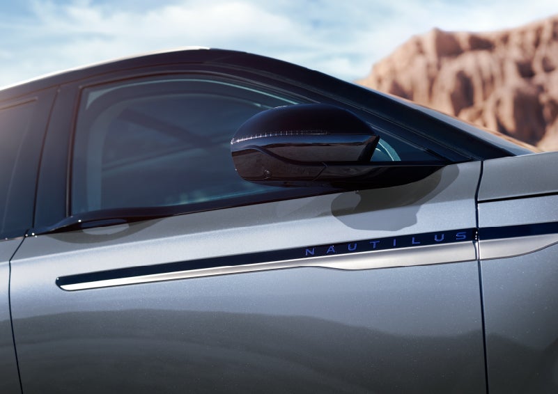 Blue lettering on the side of the vehicle that reads nautilus indicates the available hybrid powertrain. | Gary Yeomans Lincoln Ocala in Ocala FL