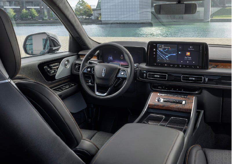 The interior of the 2026 Lincoln Aviator® SUV is shown parked with a view of a harbor through the windshield. | Gary Yeomans Lincoln Ocala in Ocala FL