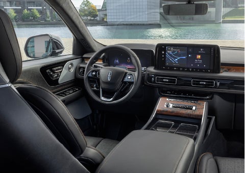 The interior of the 2026 Lincoln Aviator® SUV is shown parked with a view of a harbor through the windshield. | Gary Yeomans Lincoln Ocala in Ocala FL