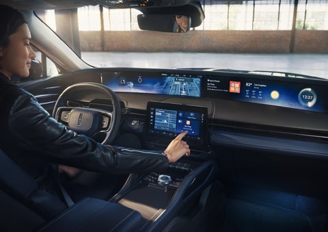 The driver of a 2026 Lincoln Nautilus® SUV interacts with the center touchscreen. | Gary Yeomans Lincoln Ocala in Ocala FL