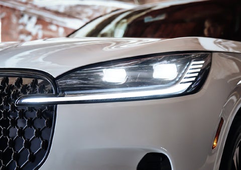 A close-up of a headlamp on the 2027 Lincoln Aviator® SUV is shown. | Gary Yeomans Lincoln Ocala in Ocala FL