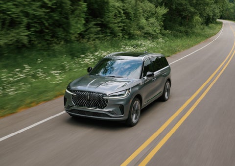 A 2027 Lincoln Aviator® SUV is being driven down a road. | Gary Yeomans Lincoln Ocala in Ocala FL