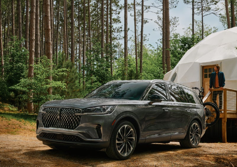 A 2027 Lincoln Aviator® is parked next to a high end glamping site. | Gary Yeomans Lincoln Ocala in Ocala FL
