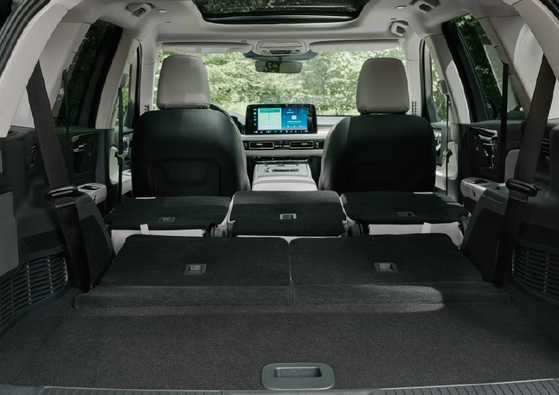 A rear to front view of the interior of a 2027 Lincoln Aviator® Black Label™ SUV shows the third and second rows folded flat | Gary Yeomans Lincoln Ocala in Ocala FL