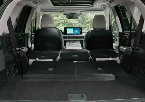 A rear to front view of the interior of a 2027 Lincoln Aviator® Black Label™ SUV shows the third and second rows folded flat | Gary Yeomans Lincoln Ocala in Ocala FL