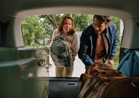 A couple loads luggage into the rear of a 2027 Lincoln Aviator® Black Label™ SUV..e 202 | Gary Yeomans Lincoln Ocala in Ocala FL